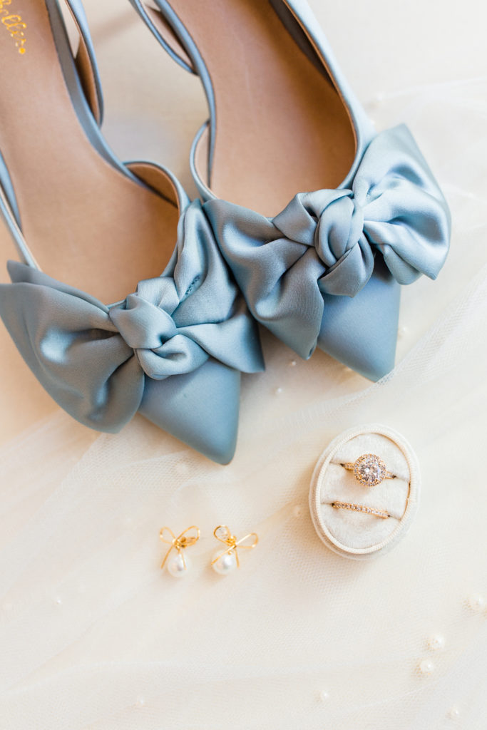 Light Blue wedding shoes, diamond engagement ring, and pearl earrings