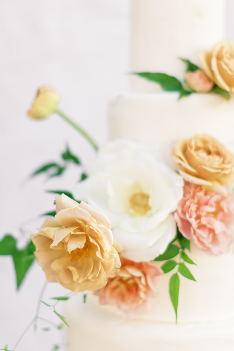 closeup of flowers on summer wedding cake
